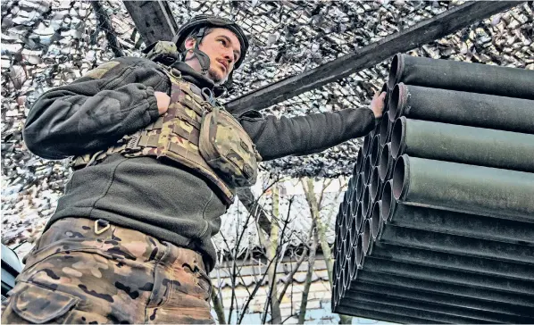  ?? ?? ‘Sgt Andrew’ points a Grad rocket launcher towards Russian-occupied Avdiivka, but he says a lack of ammunition means it has not been fired for three days