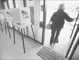  ?? Al Seib
Los Angeles Times ?? LYN LEVINE, 80, votes at a polling place in Encino. She was among the meager 16% of the city’s registered voters to mark a ballot.