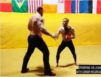  ??  ?? SPARRING (IN JEANS) WITH CONOR MCGREGOR