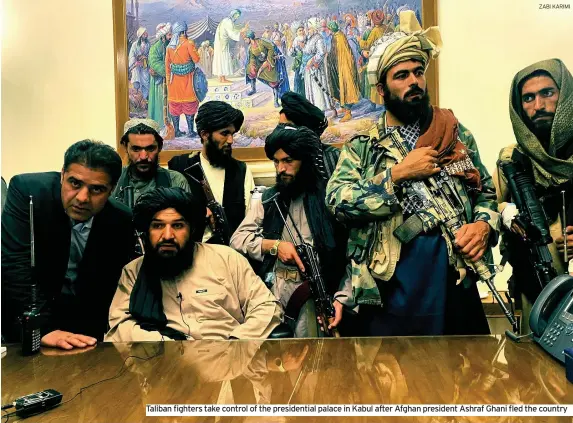  ?? ZABI KARIMI ?? Taliban fighters take control of the presidenti­al palace in Kabul after Afghan president Ashraf Ghani fled the country