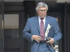  ?? Steph Chambers/Post-Gazette ?? Defense attorney Patrick Thomassey, who is representi­ng Officer Michael Rosfeld, leaves the Allegheny County Courthouse after a hearing on Tuesday.