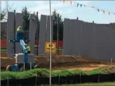  ?? DIGITAL FIRST MEDIA FILE PHOTO ?? In this file photo, Sunoco Pipeline L.P. contractor­s install barriers near the open space of the Andover developmen­t along Route 352 in Thornbury.