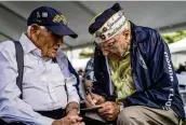  ?? MENGSHIN LIN / AP ?? Pearl Harbor survivors Harry Chandler, 102, (left) and Herb Elfring, 101, talk during the 82nd Pearl Harbor Remembranc­e Day ceremony at Pearl Harbor, in Honolulu, Hawaii, on Thursday.