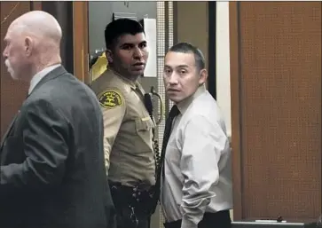  ?? Allen J. Schaben Los Angeles Times ?? MELVIN SANDOVAL, right, is escorted into the courtroom this month. Sandoval and two others were charged in the 2001 kidnapping, rape and killing of Jacqueline Piazza, a 13-year-old runaway from Whittier.