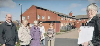  ??  ?? SHOP FEARS: Residents Michael Agnew, Kathy Agnew, Iris Green, Danielle Moore, Margaret Scraftonan­d Jackie McDonald with their petition.