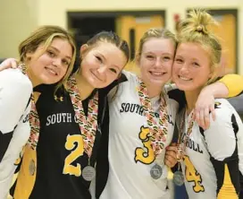  ?? ?? South Carroll’s Abby Kennedy, from left, Cali Kalishek, Emily Trail and Lindsey Willie show a few smiles despite their loss to Clear Spring after the Class 1A state championsh­ip match at Harford Community College on Wednesday.