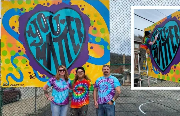  ?? (Whysong family photos) ?? MAIN: The Positive Painting Project honors Alisa (left) and Todd (right) Whysong's late daughter, Katie. The organizati­on’s first piece of public art was created by muralist Christian “Mad Rabbit” Miller (center).