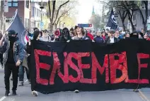  ?? VINCENZO D’ALTO ?? Anti-racist protesters march toward the suspected home of an influentia­l neo-Nazi in Rosemont—La Petite-Patrie on Saturday. When they arrived at the address, the building was heavily guarded by police.