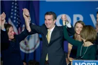  ?? AP ?? Virginia governor-elect Ralph Northam celebrates his election victory at George Mason University in Fairfax. —