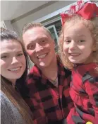  ??  ?? Lylah and her parents, Josy and Dustin Baker, who have spent day and night with her at the hospital as she battles melioidosi­s.