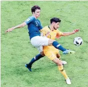  ?? AP/PTI ?? France’s Benjamin Pavard, battles for the ball with Australia’s Mathew Leckie during the group C match between France and Australia at the 2018 soccer WC in the Kazan Arena in Kazan, Russia on Saturday