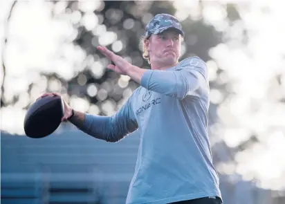  ?? SOFIE BRANDT /THE HARTFORD COURANT ?? Tim Boyle, former Xavier High and Uconn quarterbac­k, practices at the high school. Boyle is headed into his fourth NFL season and looking for meaningful playing time with the Detroit Lions. Training camp begins July 27.