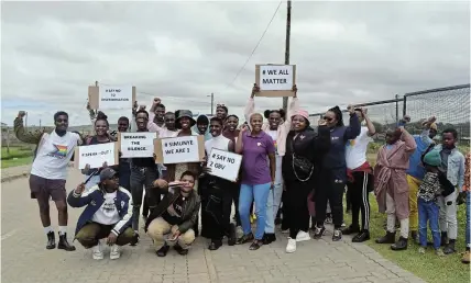  ?? Picture: SIBULELE MTONGANA ?? SPREADING AWARENESS: Nkwenkwezi Clinic staff, alongside members of the S.H.E. and Sakhuluntu NGOs march in Nemato, Port Alfred, in support of LGBTQIA+ rights.