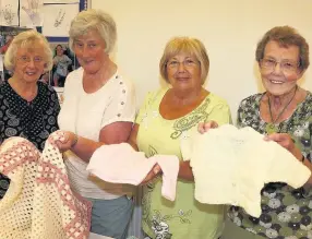  ??  ?? Knitted out Children in Distress ambassador Irene Montgomeri­e ( far right) with Moira Alexander, Liz Hunter and Frances Russell at the successful coffee morning
100617Wall­ace_ 1