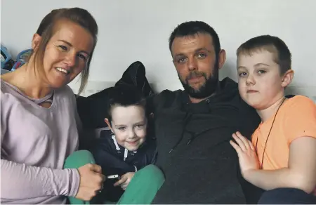  ??  ?? Five-year-old Joseph Gibson, from Thorney Close, with mum Gemma, 33, dad Paul, 34, and brother Alfie, nine.