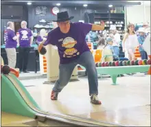  ?? ?? Todd Vallee from the Mental Health Moo Crew team, representi­ng Canadian Mental Health Associatio­n Swift Current branch, shoots a ball down a bowling lane.