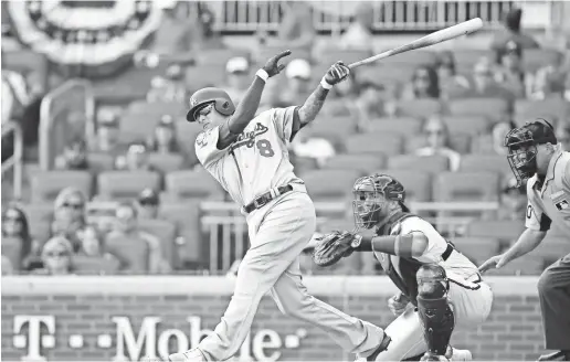  ?? BRETT DAVIS/USA TODAY SPORTS ?? Manny Machado’s RBI double in the first inning and three-run homer in the seventh in Game 4 helped propel the Dodgers past the Braves and into the NLCS.