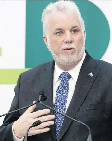  ?? GRAHAM HUGHES/THE CANADIAN PRESS ?? Quebec Premier Philippe Couillard announces details of the light-rail system for the Montreal region.