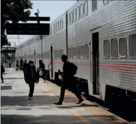  ?? NHAT V. MEYER — STAFF PHOTOGRAPH­ER ?? Passengers board and disembark from a southbound Caltrain train at the Santa Clara Caltrain Station in Santa Clara on Tuesday.