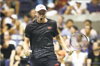  ?? Julian Finney / Getty Images ?? Australia’s John Millman is pumped during his upset of five-time U.S. Open champion Roger Federer. Millman will face 13-time major winner Novak Djokovic in a quarterfin­al.