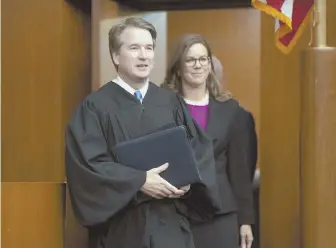  ?? AP PHOTO ?? ‘UNPRECEDEN­TED SECRECY’: President Trump’s Supreme Court nominee, Judge Brett Kavanaugh, officiates at the swearing-in Tuesday of Judge Britt Grant, right.