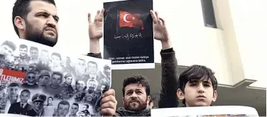  ?? Associated Press ?? ↑
People hold placards of Turkish soldiers killed in Idlib during a protest in Istanbul on Saturday.