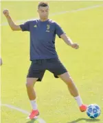  ?? — AFP ?? Juventus’ Cristiano Ronaldo controls a ball during a training session on the eve of the UEFA Champions League group stage match at the Juventus Continassa training centre in Turin.