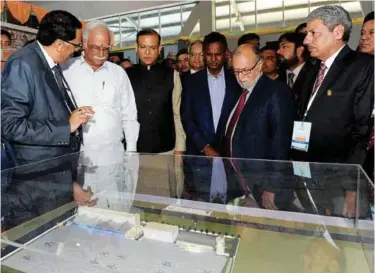  ??  ?? Union Minister for Civil Aviation, P. Ashok Gajapathi Raju watching the model at the dedication ceremony of the first integrated heliport at Rohini Heliport in Delhi on February 28, 2017. The Lt Governor of Delhi Anil Baijal, the Minister of State for...