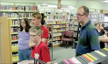  ?? COURTESY PHOTO ?? Lincoln Public Library hosted Family Game Night on April 10. Pictured on the left are: Lexie Jordon, James Delona and Kanoa Smith. On the right are event hosts Zack and Sandy Cole with baby Grayson Cole.