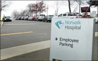  ?? Erik Trautmann / Hearst Connecticu­t Media ?? People wait in line for coronaviru­s testing at Norwalk Hospital on April 8.