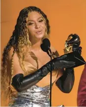  ?? CHRIS PIZZELLO/AP PHOTOS ?? Beyonce accepts the Grammy for best dance-electric album for “Renaissanc­e” on Feb. 5. It was her 32nd award, breaking the record for all-time Grammy wins.