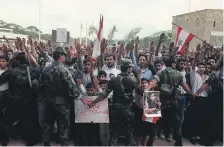  ?? AFP ?? Soldiers hold the line against Lebanese Christian students protesting against the Taif deal in 1989