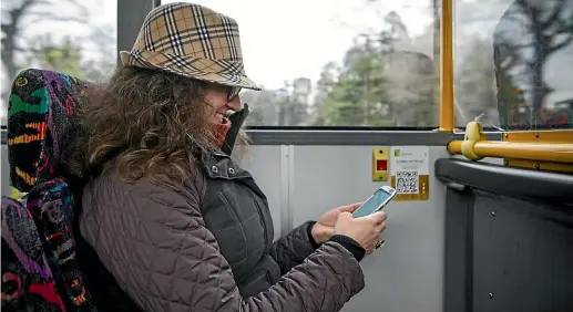  ?? DAVID WALKER/ STUFF ?? Commuting Book is the brainchild of Magdalena Lorenzo, who began by dropping donated books at bus stops and has subsequent­ly been working to develop the idea where passengers can read a short story or poetry on their phone using one of 20 different QR...