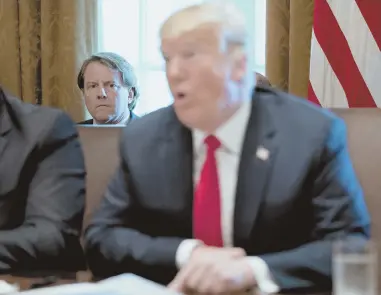  ?? AP FILE PHOTO ?? HEADED OUT: White House counsel Don McGahn, seen behind President Trump at a recent Cabinet meeting, will be leaving his post in the fall according to a tweet posted yesterday by the president.
