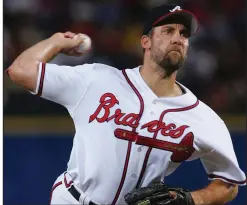  ?? (AP file photo) ?? Atlanta’s John Smoltz became the 16th pitcher in major league history to reach the 3,000-strikeout plateau on this date in 2008.