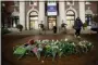  ?? MARY ALTAFFER, FILE - THE AP ?? In this 2019 file photo, a woman walks past a make-shift memorial for Tessa Majors inside the Barnard College campus in New York. Authoritie­s say a 14-year-old was arrested in fatal stabbing of Majors on Saturday, Feb. 15. Majors was stabbed as she walked through Manhattan’s Morningsid­e Park on Dec. 11.