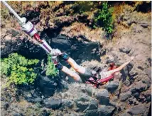  ??  ?? Verna bungee jumping from Victoria Falls Bridge in Africa