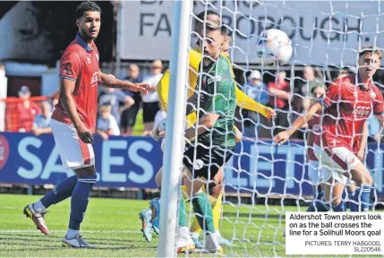  ?? PICTURES: TERRY HABGOOD, SL220546 ?? Aldershot Town players look on as the ball crosses the line for a Solihull Moors goal