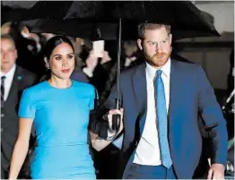  ?? KIRSTY WIGGLESWOR­TH/AP ?? Prince Harry and Meghan, seen in March, are suing to stop the sale of a photo of Archie.