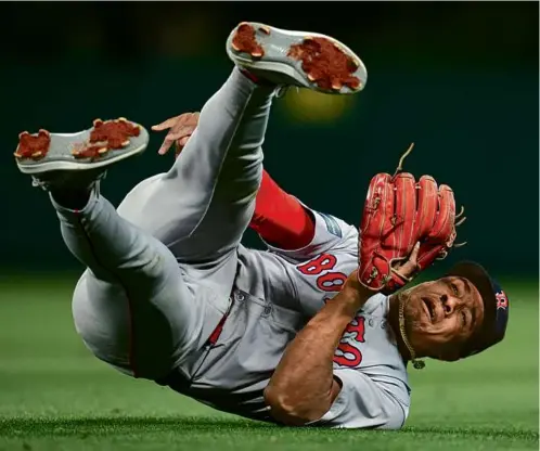  ?? MARCIO JOSE SANCHEZ/ASSOCIATED PRESS ?? Second baseman Enmanuel Valdez makes a throw to first after a diving stop on a grounder by Luis Rengifo.