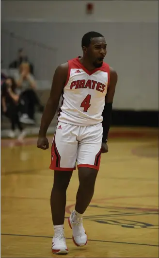  ?? PAUL DICICCO — FOR THE NEWS-HERALD ?? Perry’s Jaylen Anderson celebrates during the Pirates’ overtime win over rival Madison on Feb. 22.