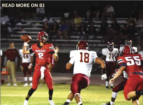  ?? PHOTO AARON BODUS ?? Imperial quarterbac­k Jordan Reed (2) surveys the field during the first half of the Tigers 26-25 home win over the Monte Vista Monarchs on Friday. Reed finished the night with three passing touchdowns.