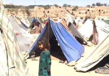  ??  ?? Makeshift tents cover a barren hillside outside Qala-e Nau, Afghanista­n, erected by farming families fleeing drought and conflict in western Badghis province. — Washington Post photos by Pamela Constable