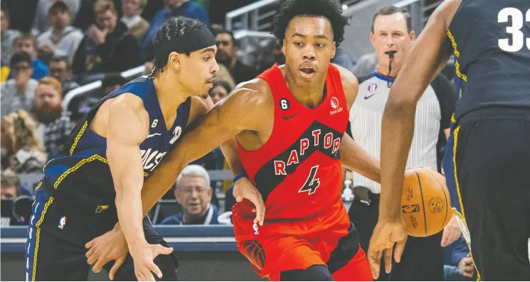  ?? TREVOR RUSZKOWSKI / USA TODAY SPORTS ?? Toronto Raptors forward Scottie Barnes, right, tries to get past Indiana Pacers guard Andrew Nembhard during Saturday’s game at Gainbridge Fieldhouse in Indianapol­is.
Barnes has struggled a bit this year after being named the NBA’S rookie of the year last season, but teammates such as Thad Young aren’t worried.