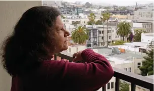  ?? Associated Press ?? ■ Census taker Linda Rothfield looks out June 30 at the Mission District area where she worked in San Francisco. Some census takers worry that renters in apartment buildings were not tallied fully during the nation’s head count last year. Census takers say they had difficulty entering apartment buildings due to COVID restrictio­ns, and they weren’t able to get in touch with landlords for help.