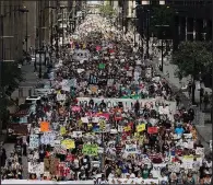  ?? AP/Chicago Tribune/ABEL URIBE ?? Thousands of people rally against President Donald Trump’s immigratio­n policy Saturday during a march from Daley Plaza to Chicago’s field office for Immigratio­n and Customs Enforcemen­t.