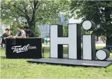  ?? DAVID FRIEND ?? Representa­tives for Tweed Inc., a licensed producer of cannabis, mingle with concertgoe­rs at the Field Trip music festival in Toronto on June 3. Music festivals and cannabis producers are trying to navigate mutually beneficial relationsh­ips within the...