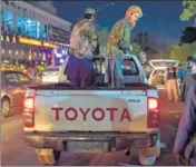  ?? AFP ?? Taliban fighters are seen standing on a pickup truck outside a hospital where injured people were being treated, in Kabul.