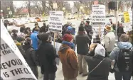  ?? Peter Hvizdak / Hearst Connecticu­t Media file photo ?? Protesters demonstrat­e in front of a Wells Fargo bank branch in in New Haven in January 2017.