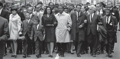  ?? Getty Images file photo ?? Coretta Scott King leads a march in Memphis five days after the assassinat­ion of her husband, Martin Luther King Jr. Her faith and determinat­ion never wavering, she fought for a national holiday to honor her husband.